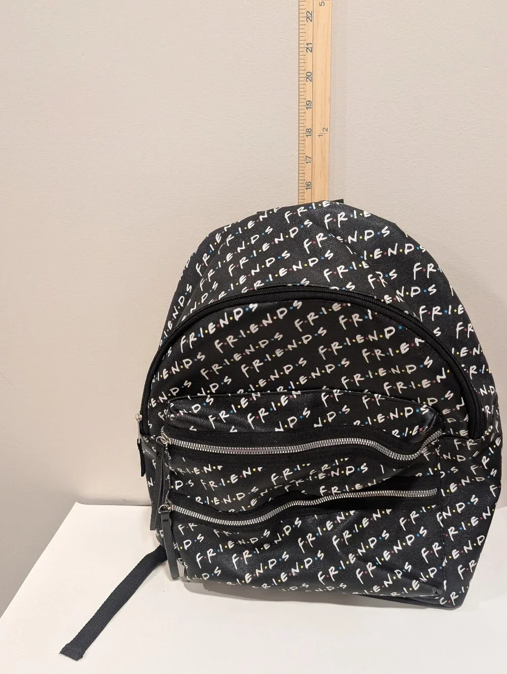 Friends Backpack all over print. need small repair see zoomed in photo